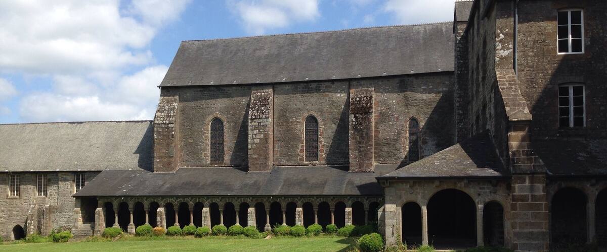 A historic building with a large courtyard and arched walkways.