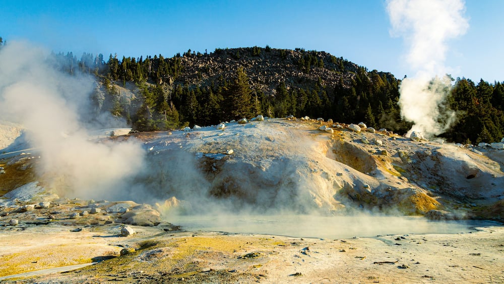 Large boiling mud pot at Bumpass Hell in Lassen Volcanic National Park in Northern California, USA.