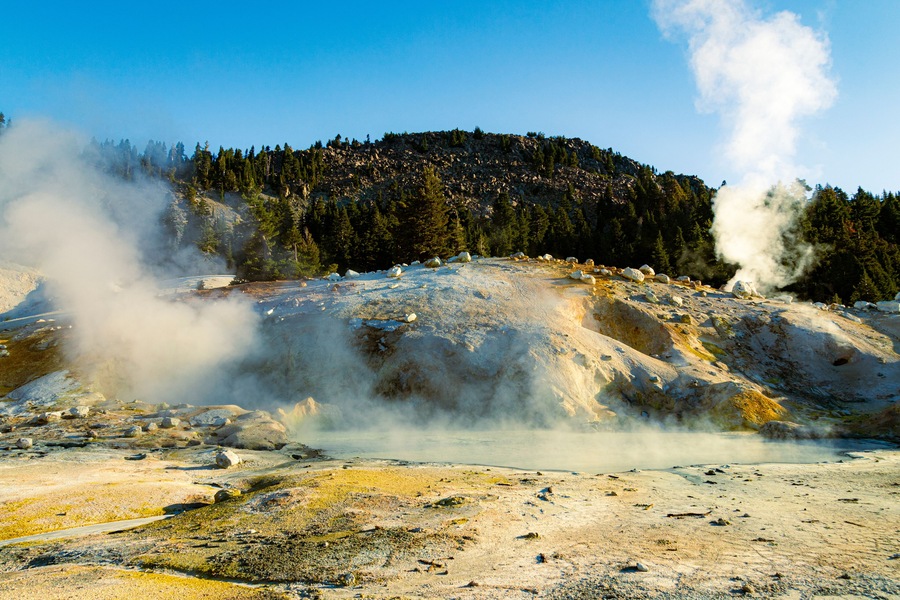 Large boiling mud pot at Bumpass Hell in Lassen Volcanic National Park in Northern California, USA.