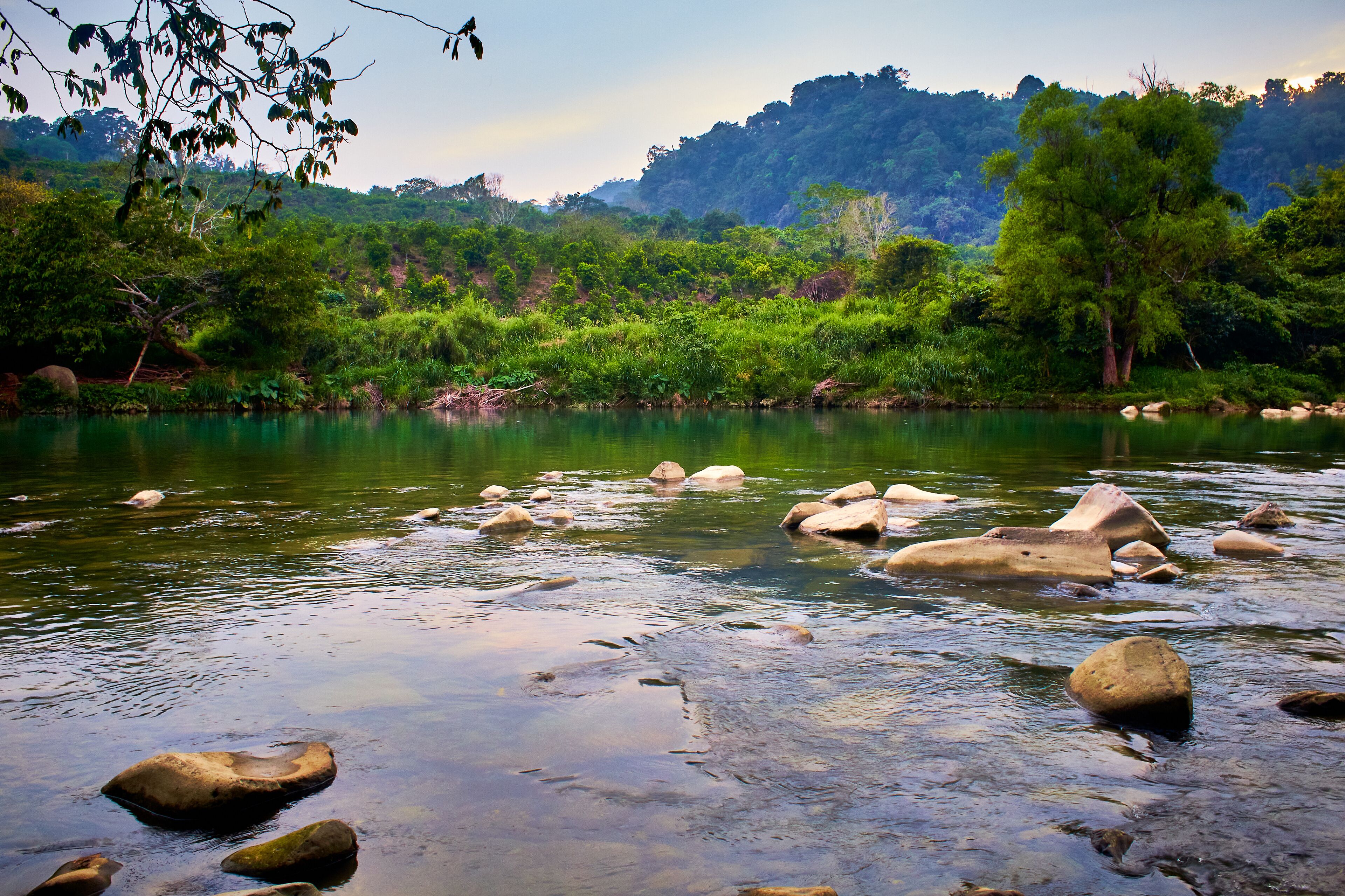 green river in middle of the jungle with cloudy sky and mountains in the background, in filobobo river, martinez de la torre veracruz 