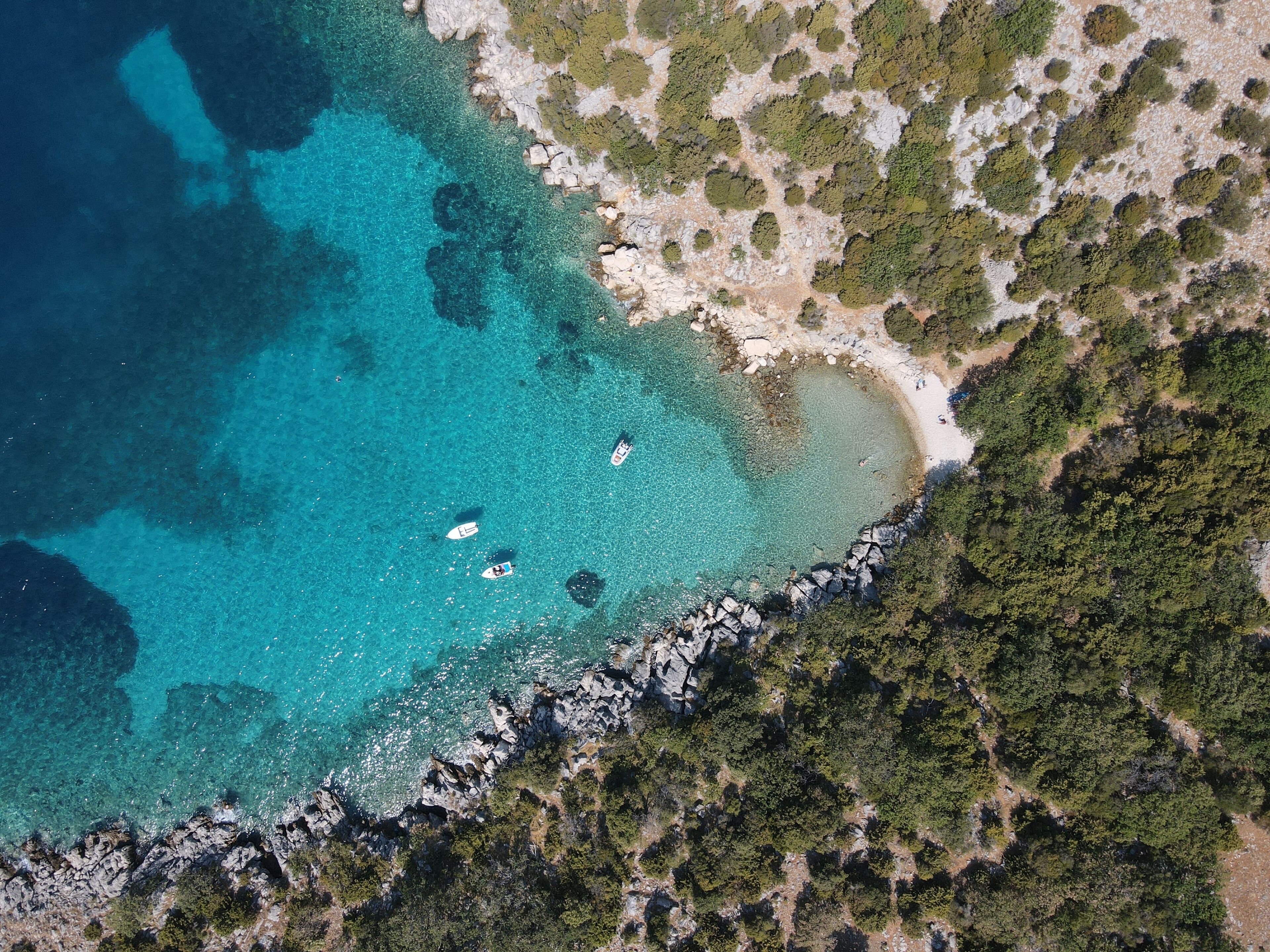 Aerial view of Potocnica, Lun and Novalja in island of Pag, archipelago of Croatia. Panoramic drone view of waterfront, idyllic and turquoise sea in Novalja, Adriatic Sea in Dalmatia region.
