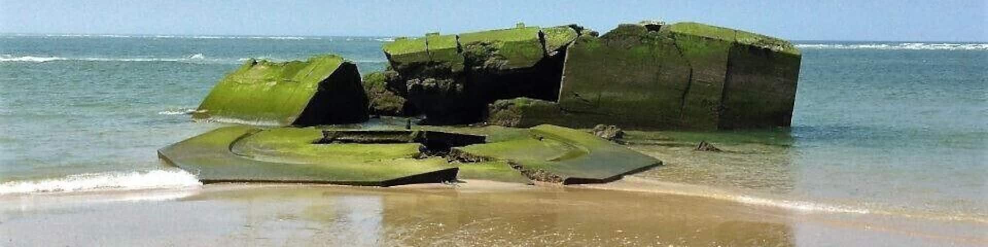 Remnant from WWII German "blockhaus" lying on the beach #lifeatexpedia
