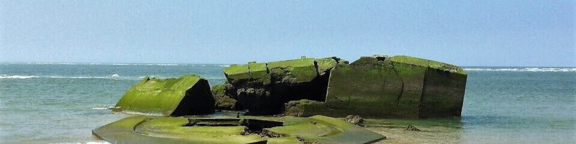 Remnant from WWII German "blockhaus" lying on the beach #lifeatexpedia