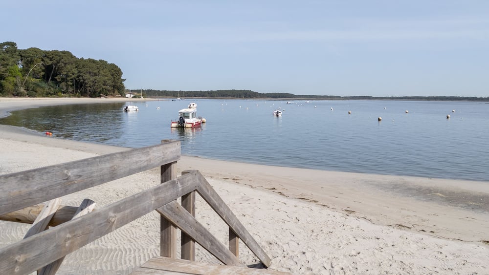lege cap ferret wooden sea access pathway leading to sand beach atlantic ocean horizon in Arcachon bay in france