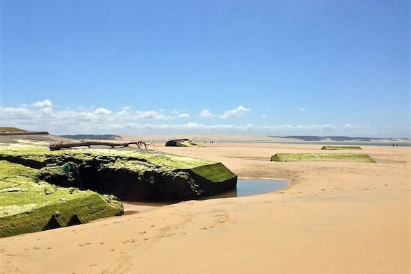 Remnant from WWII German "blockhaus" lying on the beach #lifeatexpedia