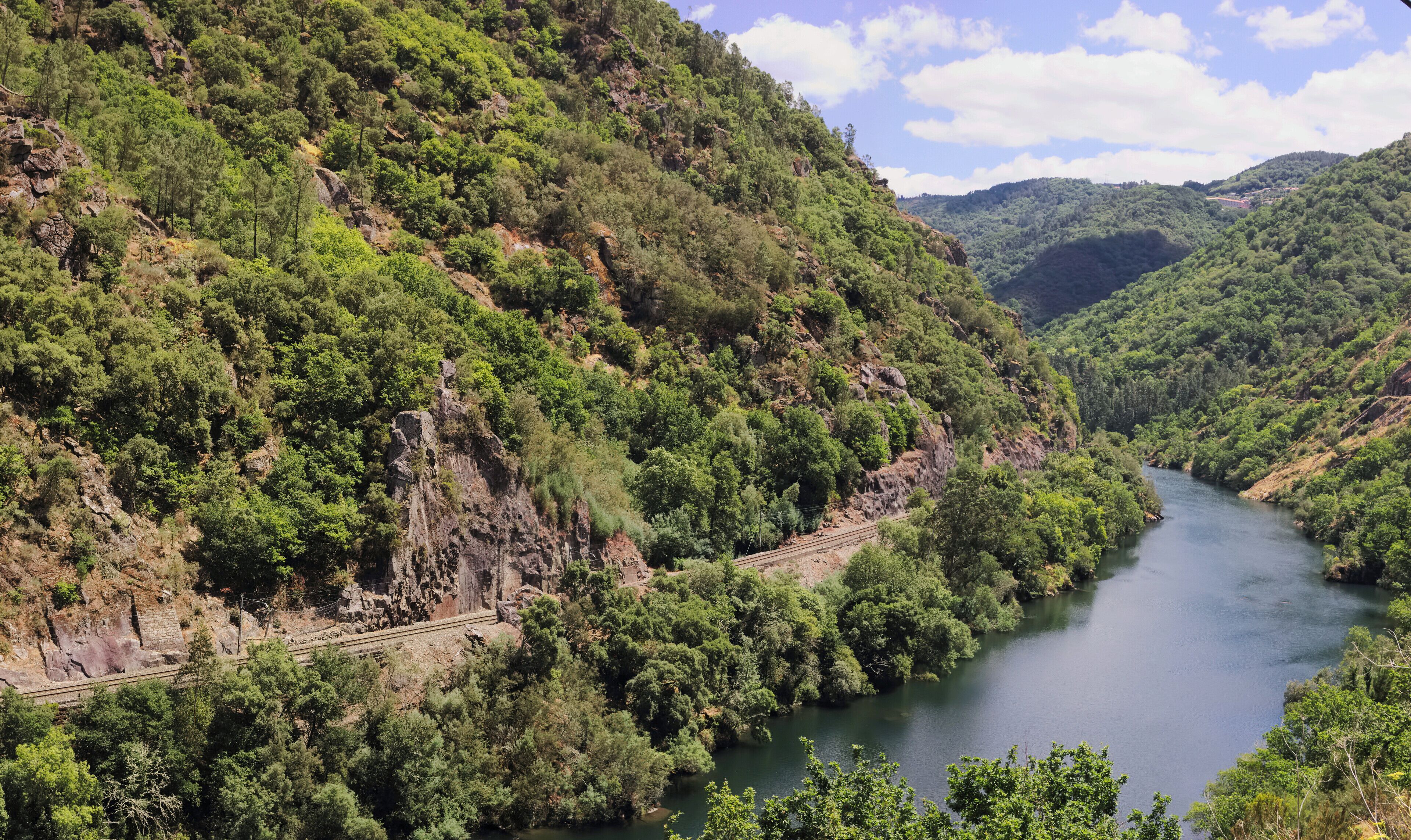 Railway in the canyon of the river Sil, Ribeira Sacra, Galicia, Spain.