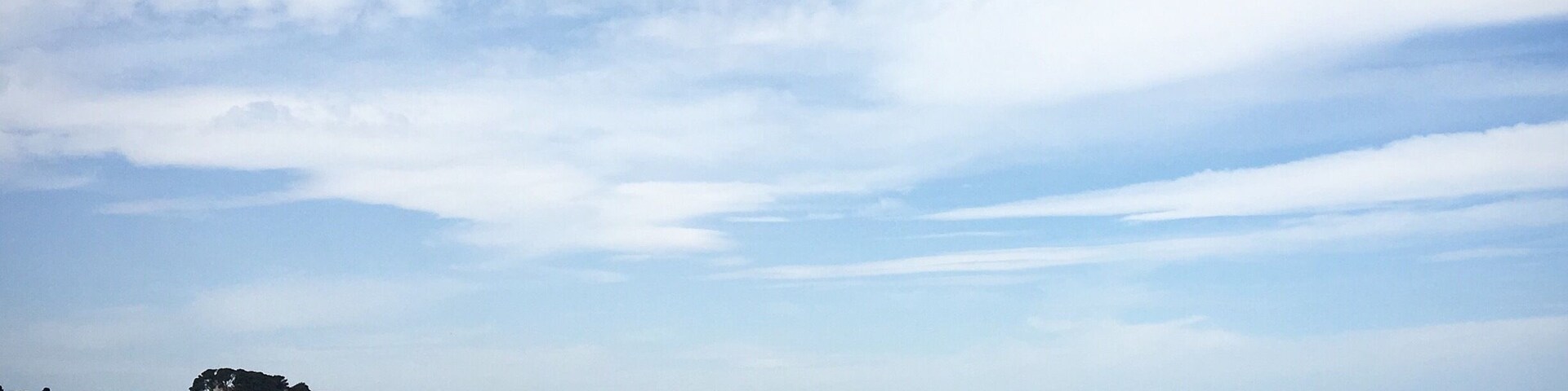 The coast near the Mediterranean village Sant Martí d’Empúries. On the other side of the  bay where you can see the outline of mountains and houses is coast of Roses.