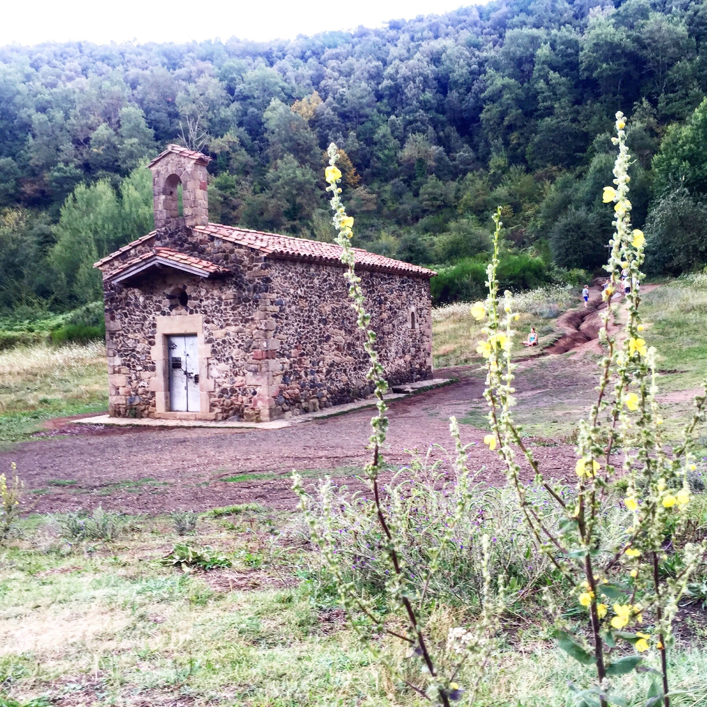 The Santa Margarida Volcano (Catalan: Volcà de Santa Margarida) is a volcano in the comarca of Garrotxa, Catalonia, Spain. The volcano has a perimeter of 2 kilometers and a height of 682 meters and is part of the Garrotxa Volcanic Zone Natural Park. The hermitage of Santa Margarida, after which the volcano was named, is inside the crater of the volcano. The building was destroyed in 1428 during the 1428 Catalonia earthquake and rebuilt in 1865.