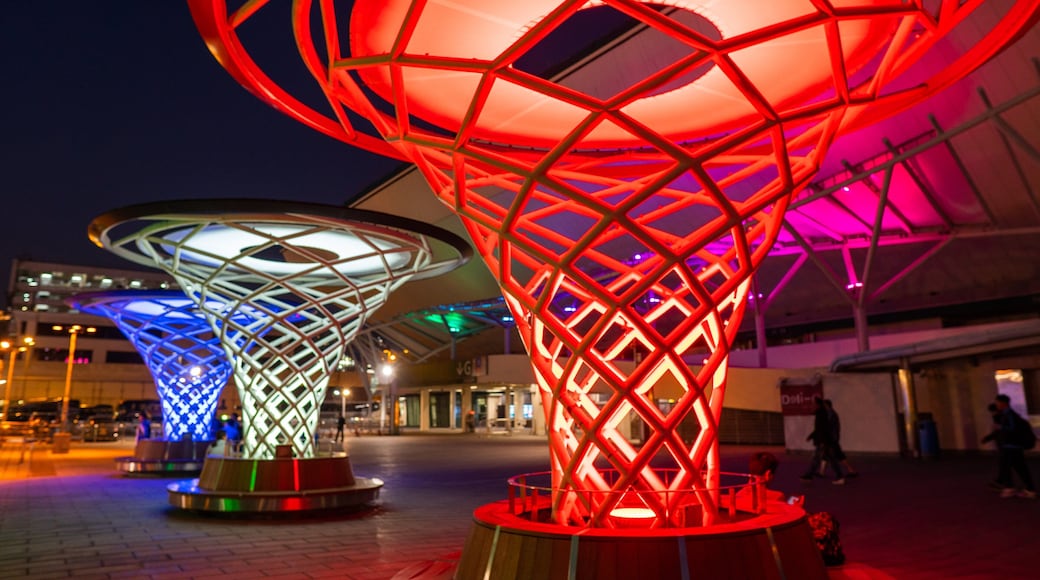Hong Kong Coliseum featuring night scenes and outdoor art