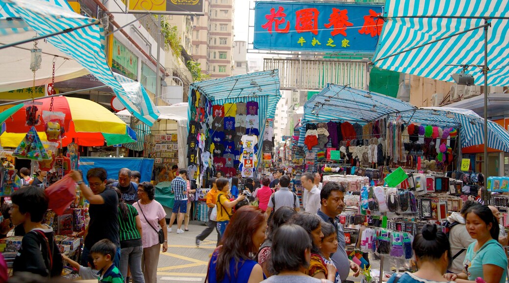 女人街 呈现出 市集 和 看板 以及 大群人