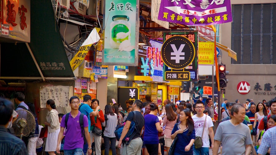 Ladies\' Market which includes markets and signage as well as a large group of people