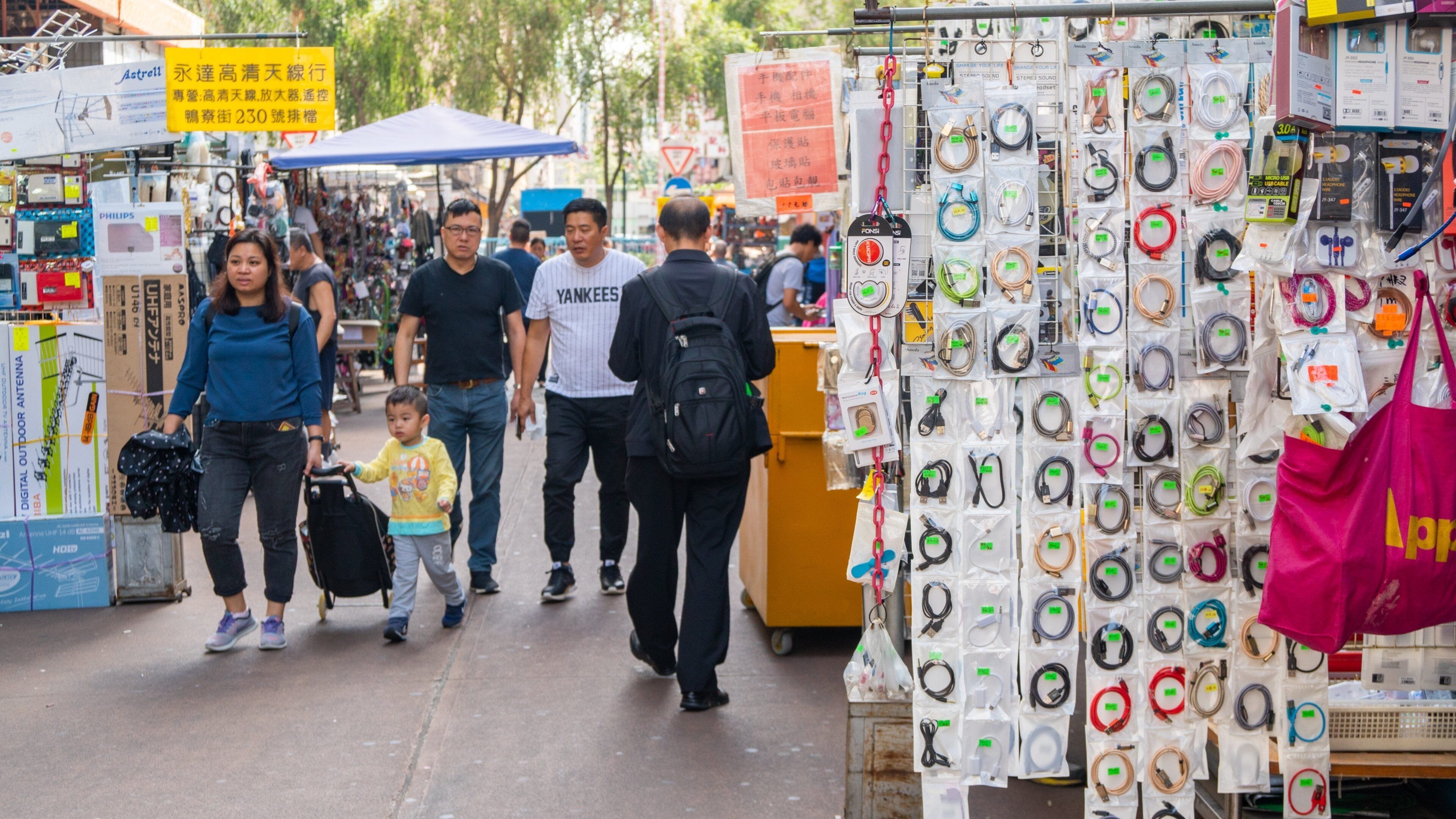 Apliu Street Market showing markets and street scenes as well as a small group of people