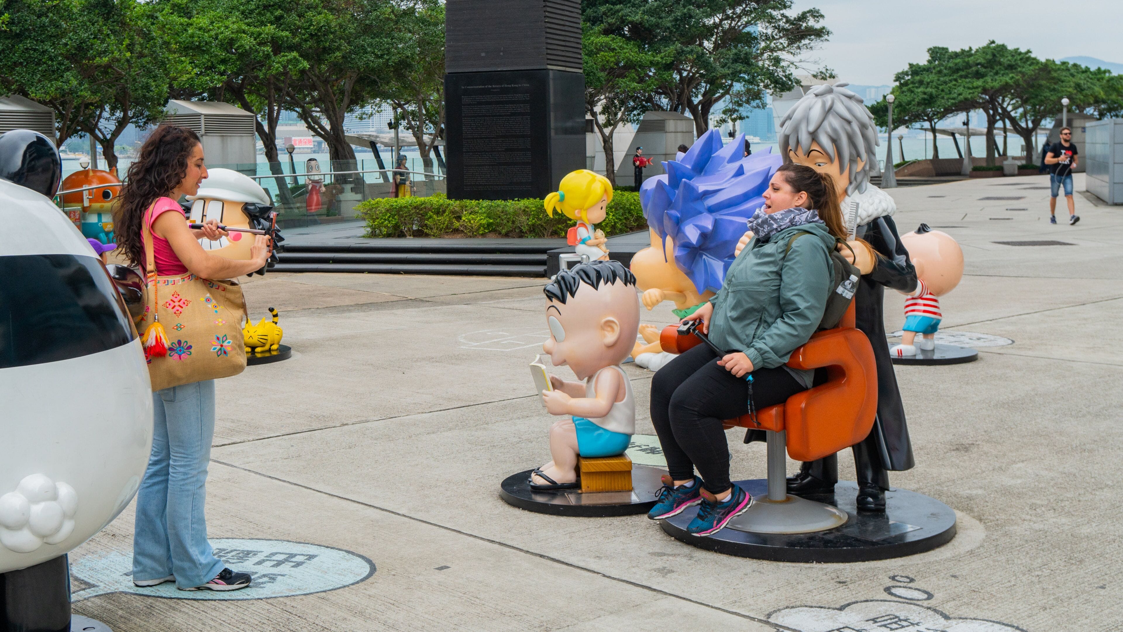 Golden Bauhinia Square showing outdoor art as well as an individual femail