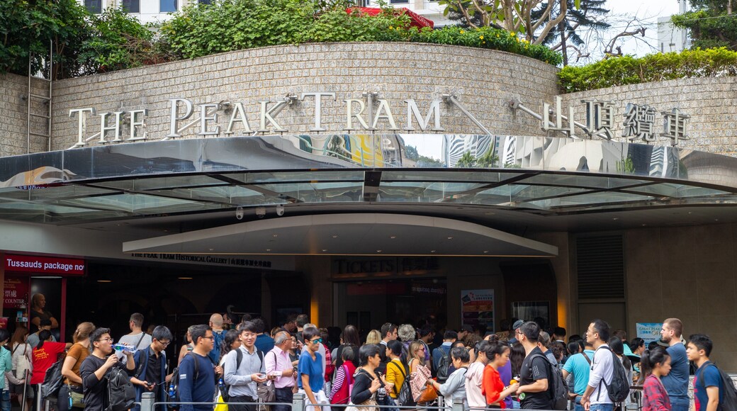 The Peak Tram featuring signage and street scenes as well as a large group of people