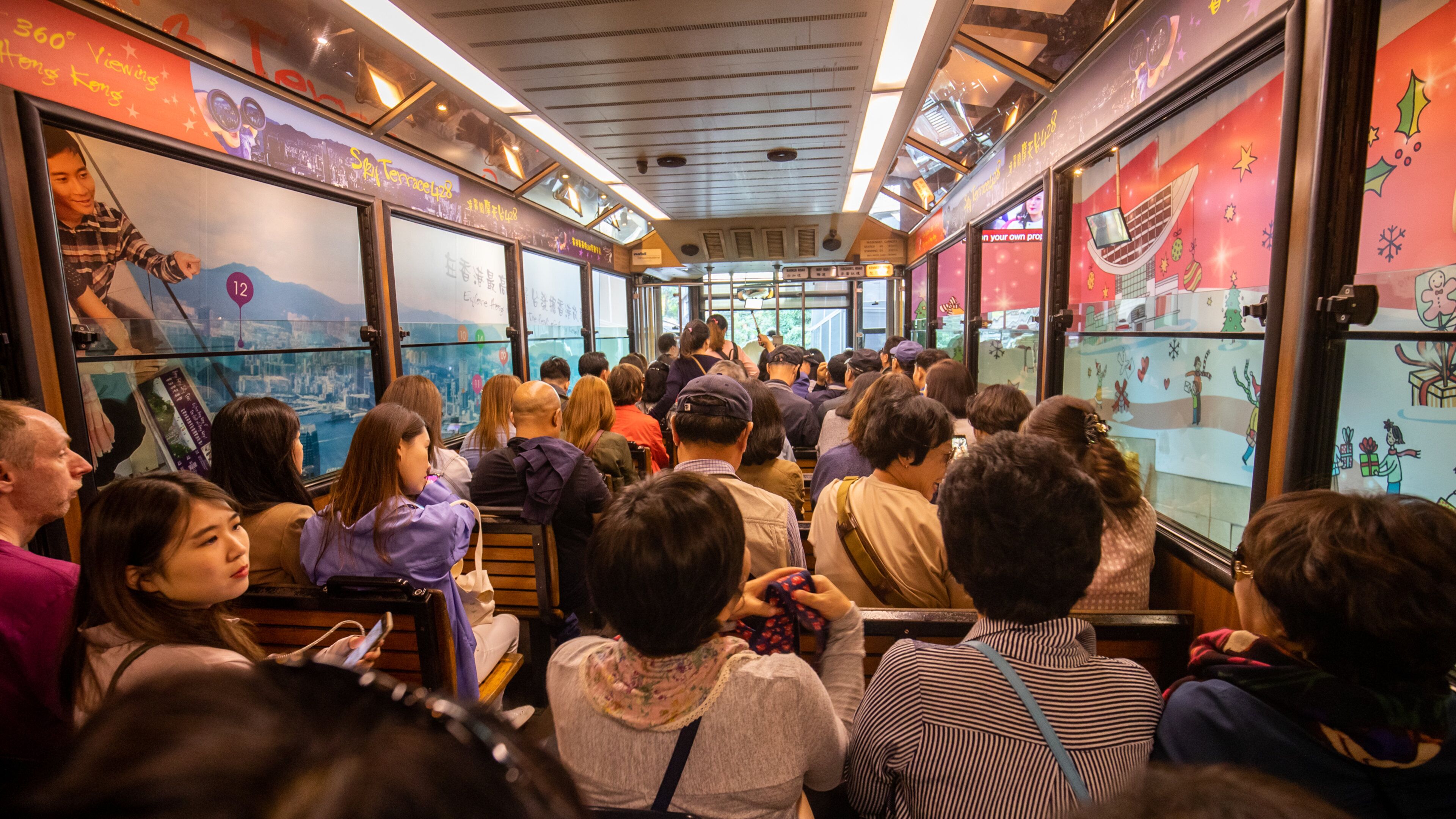 The Peak Tram which includes interior views and railway items as well as a large group of people