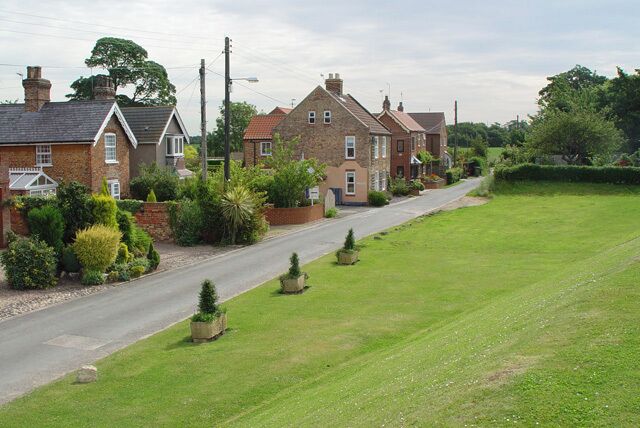 Mill Lane, Saltmarshe, East Riding of Yorkshire, England. The photograph was taken looking east from the flood bank of the Ouse, which is still tidal at this point. This is the eastern end of the village.