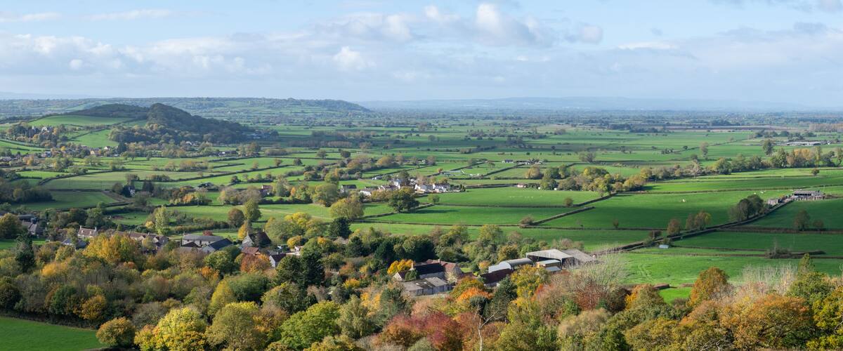 Panoramic photo of the autumn colours in the village of Compton Dundon on the Somerset levels