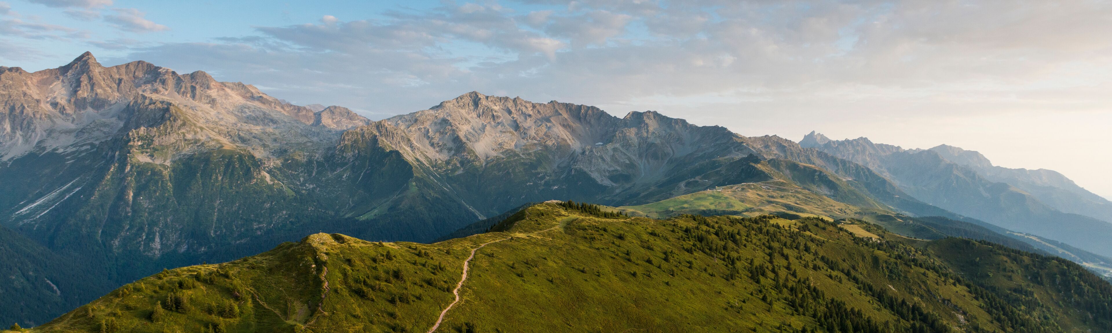 A mountain range with a winding path.