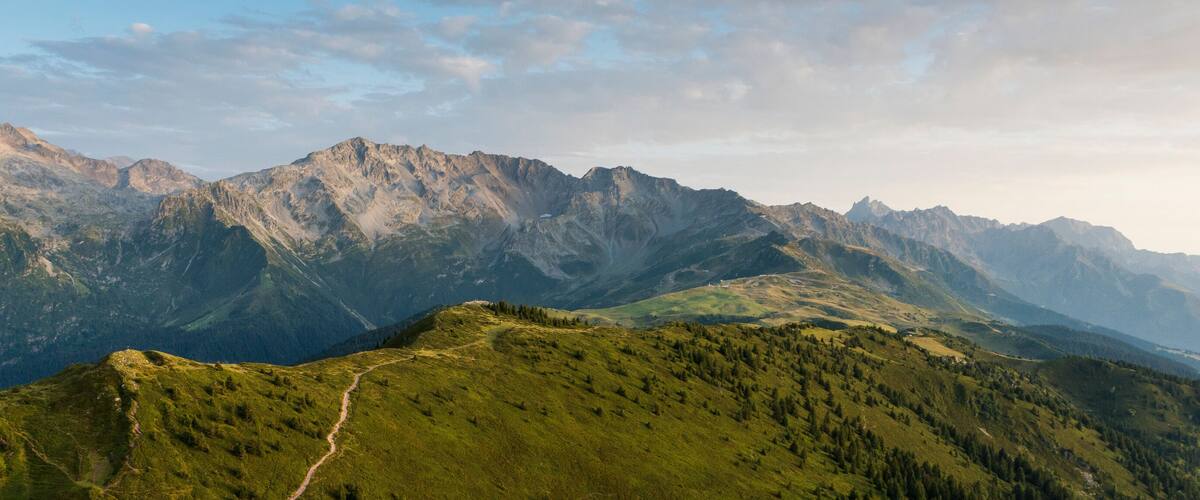 A mountain range with a winding path.