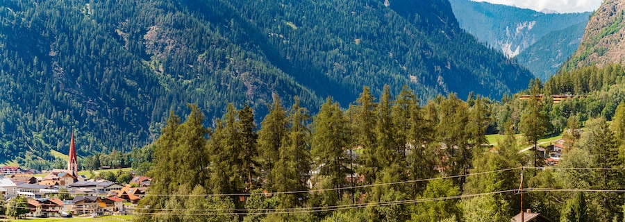 Alpine summer view with a church at Umhausen, Imst, Oetztal valley, Tyrol, Austria