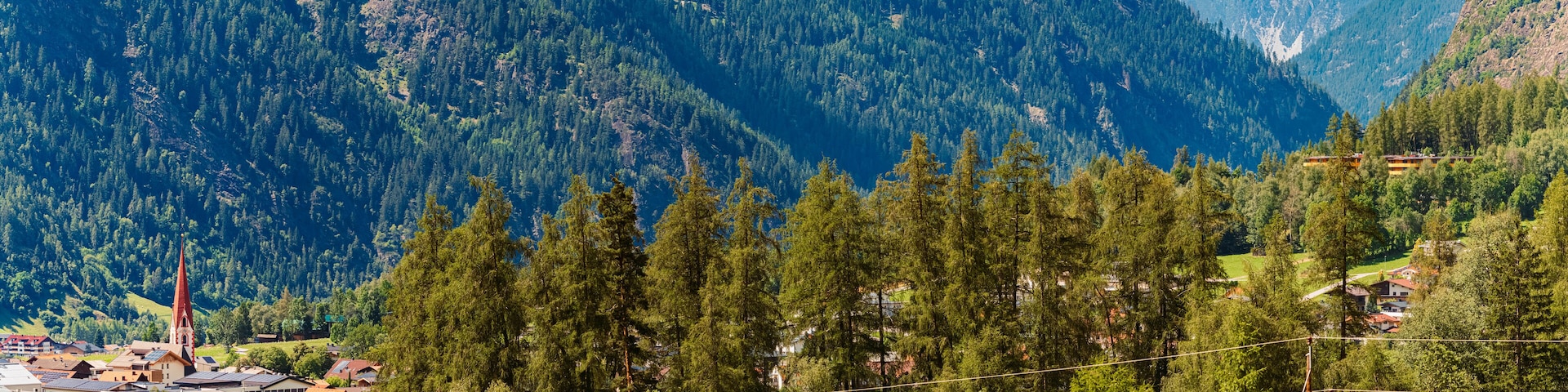 Alpine summer view with a church at Umhausen, Imst, Oetztal valley, Tyrol, Austria