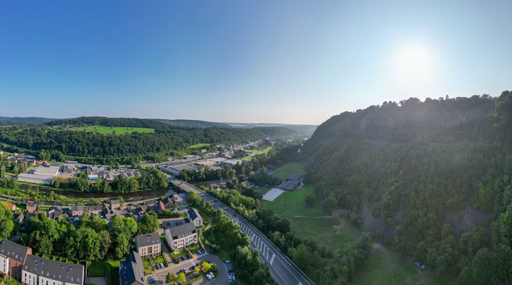 Sougne-Remouchamps, Aywaille, Liege, Wallonie, Belgium, August 10, 2025, A breathtaking panoramic view of a lush, green valley featuring sunlit hills under a vibrant, clear blue sky