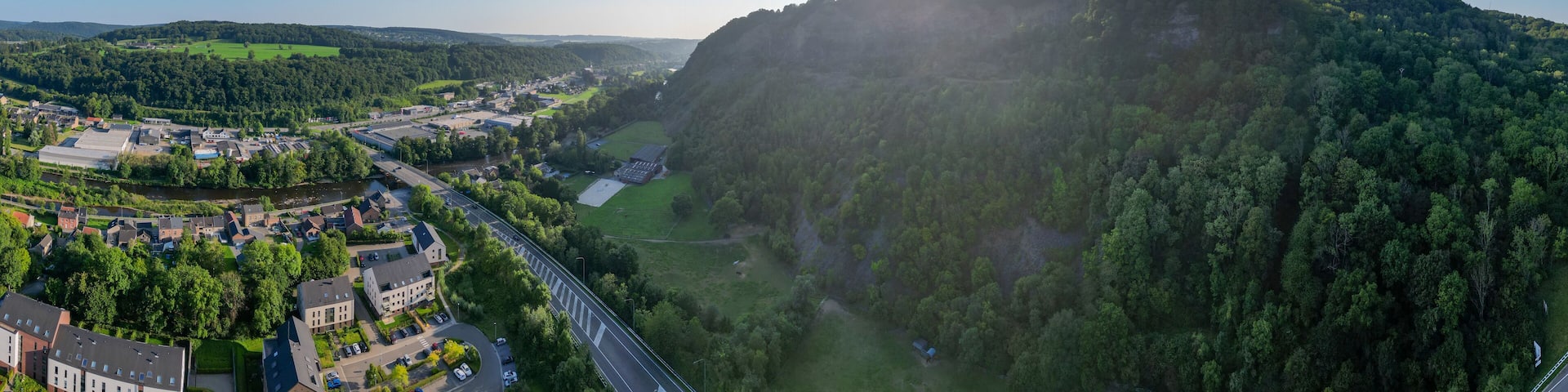 Sougne-Remouchamps, Aywaille, Liege, Wallonie, Belgium, August 10, 2025, A breathtaking panoramic view of a lush, green valley featuring sunlit hills under a vibrant, clear blue sky