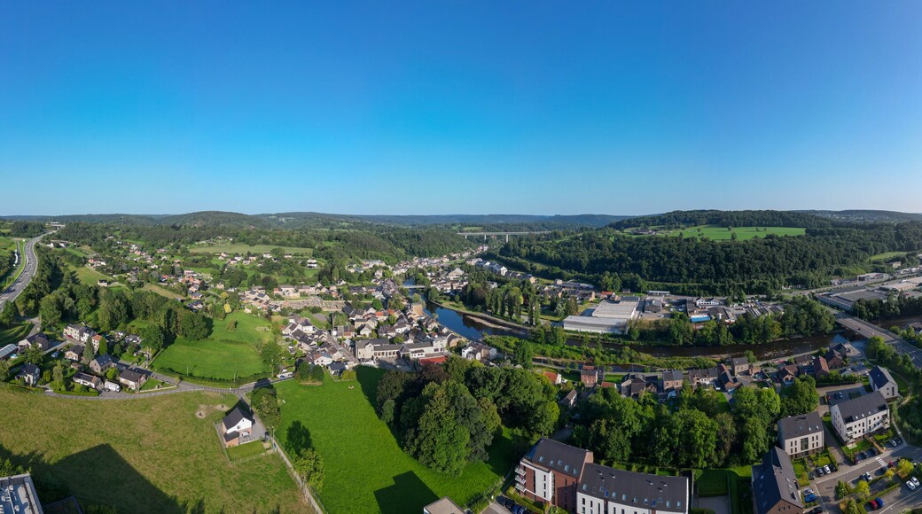 Sougne-Remouchamps, Aywaille, Liege, Wallonie, Belgium, August 10, 2025, A breathtaking aerial view showcases a charming countryside village that is enveloped by lush, vibrant green hills