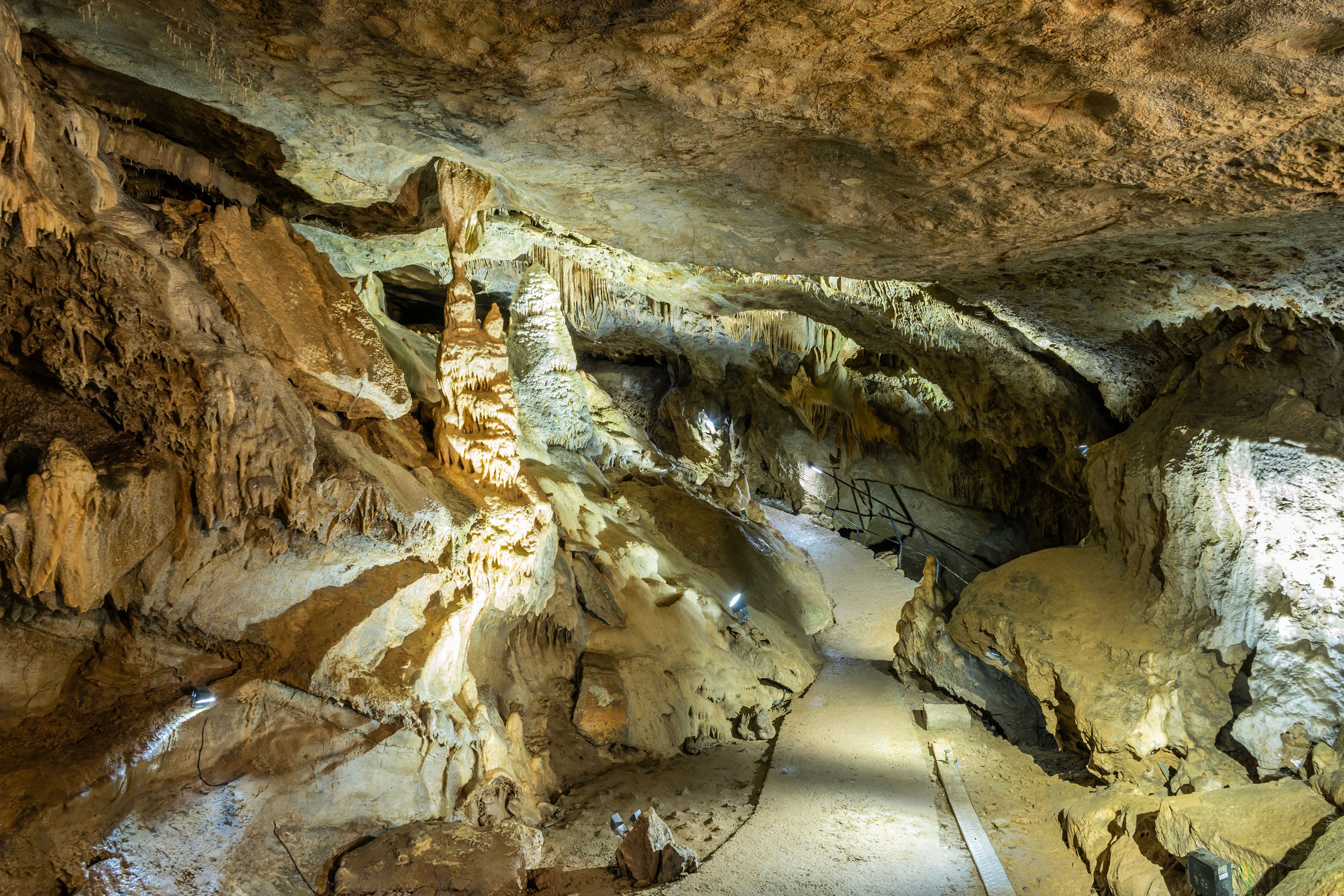 open public area of underground cave network in Belgium Ardennes called Les Grottes de Remouchamps where tourists can explore the subterranean world with impressive geological rock formations 