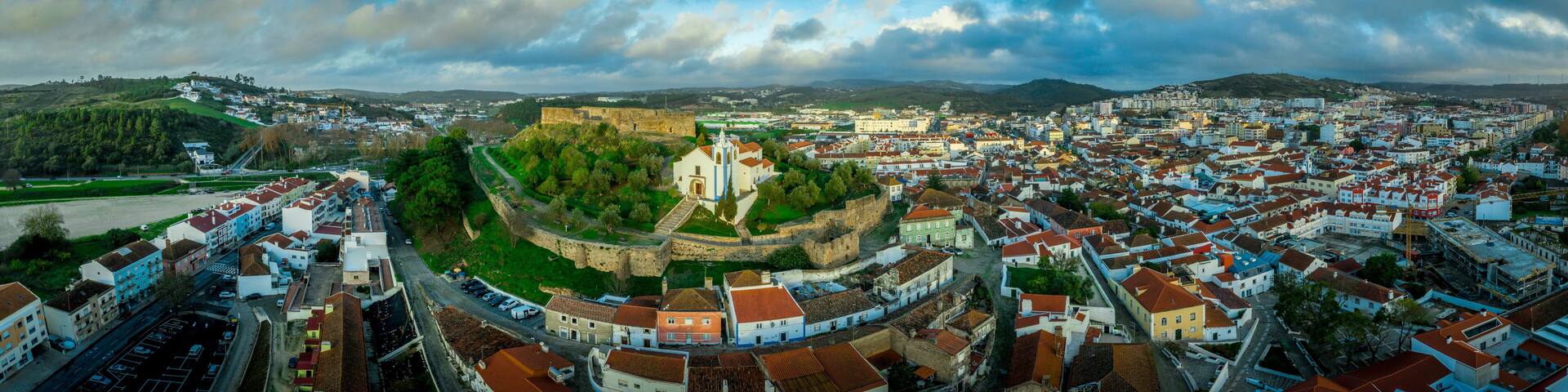 Aerial panorama of the medieval castle with Moorish origins in Torres Vedras Portugal with restored castle church and keep