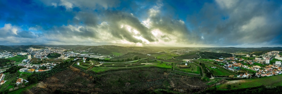Aerial view of Fort St. Vincent in Torres Vedras, nineteenth century military fortification composed of masonry and earthwork with detached bastions for cannons, ditch , counterscarp on a hill