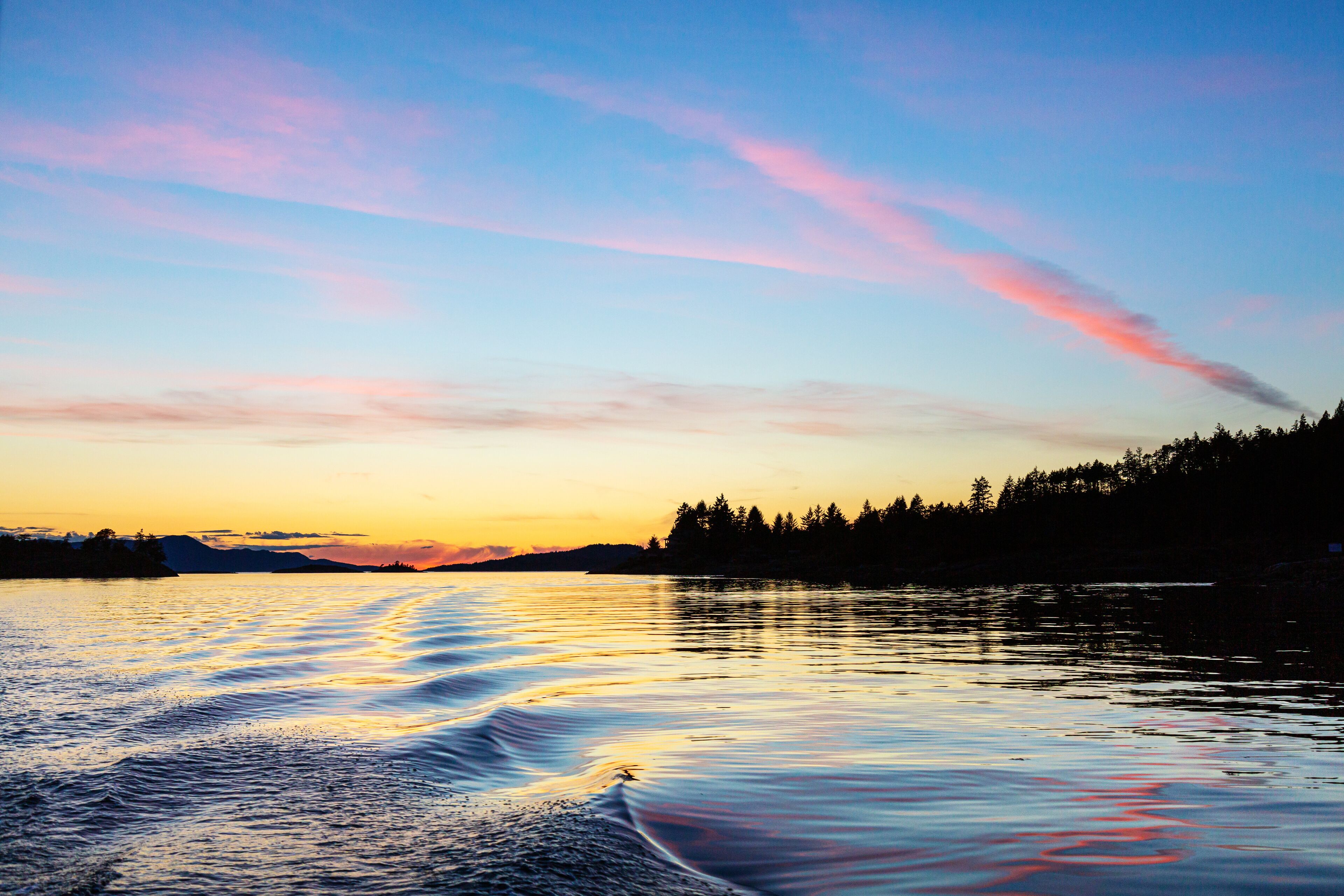 Sunset over the copeland Islands from a boat from Lund on the strait of Georgia