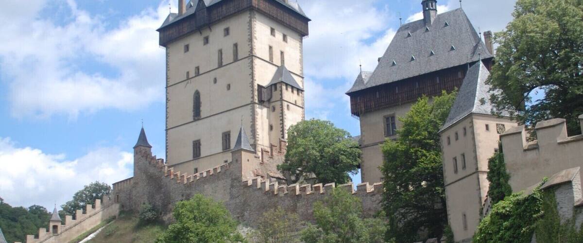 Karlštejn is a small village around 30 km southwest of Prague, and is an easy half day trip.
The main (and probably only) attraction is the impressive 14th century Gothic castle.
http://www.greengoulash.com/prague-day-trips/