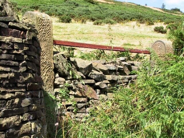 No Entry. This gateway, no longer used, once led off the Lantern Pike path into fields above the river Sett, and below the old quarry, where a transmitter mast now stands.
