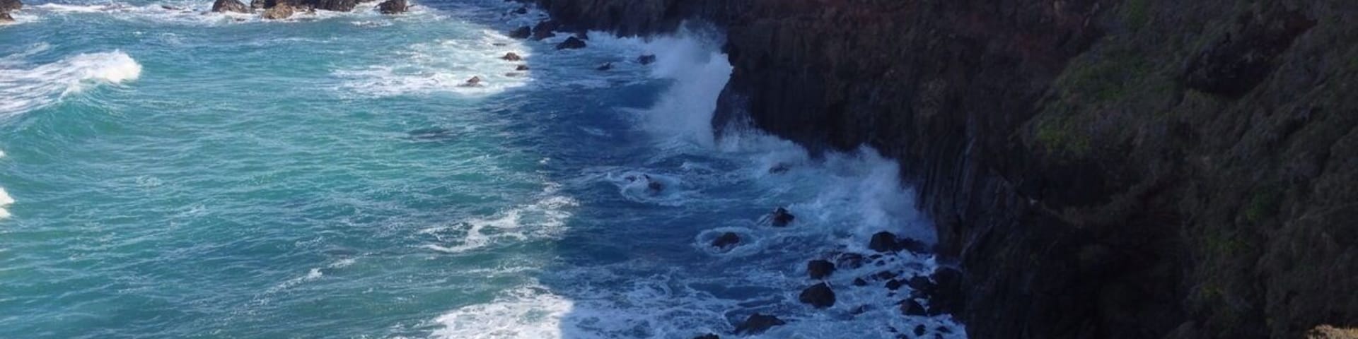 The cliffs of Pat Morton Lookout, Lennox Head, NSW. This is my favourite place in the Northern Rivers, as the sweeping meadow, high cliffs, pebbly beach and vast expanse of sea makes me feel I'm far away on an adventure.