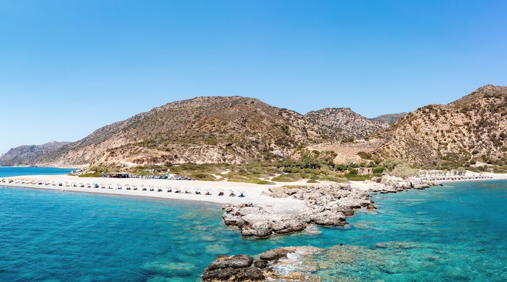 Crete Greece. Aerial drone view of pebble beach at Palaiochora, transparent crystal clear sea water.