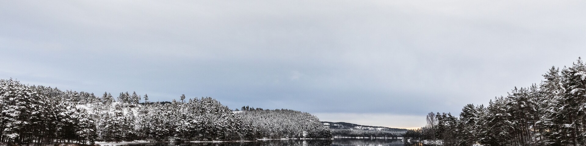 Winter landscape, open water in the Otra river, South part of Norway
