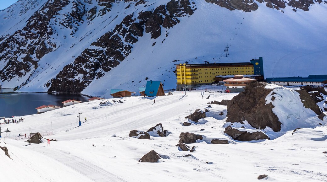 ski in chile on a sunny day with lots of snow.