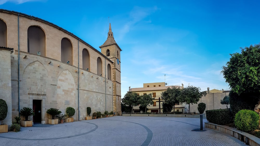 A historic building with arched windows and a clock tower.