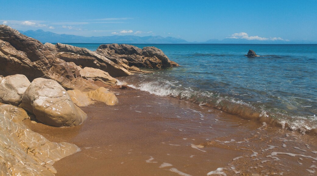 Hit the road to Koroni in Messinia, Greece. Almost near the town road get just near the beach with orange sand and blue crystal water. Perfect period to visit - end of May. Fresh but not cold water and super quiet!