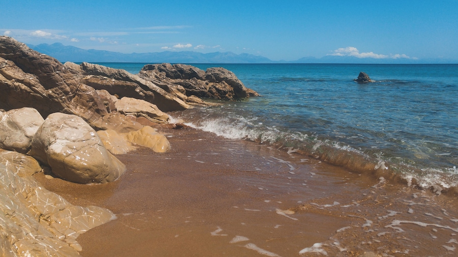 Hit the road to Koroni in Messinia, Greece. Almost near the town road get just near the beach with orange sand and blue crystal water. Perfect period to visit - end of May. Fresh but not cold water and super quiet!