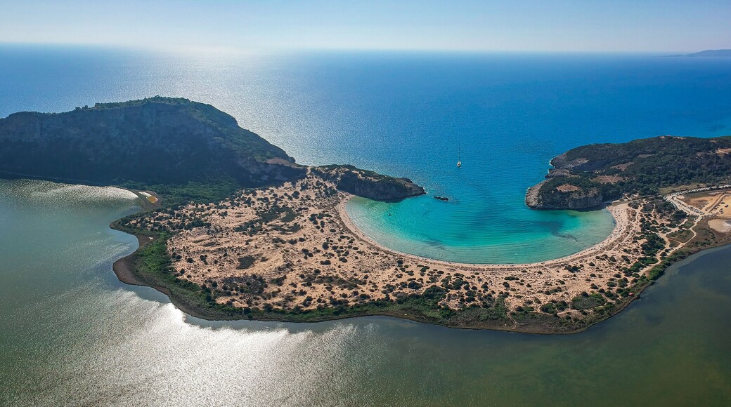 Aerial panorama view of the famous semicircular sandy beach and lagoon of Voidokilia in Messenia, Greece