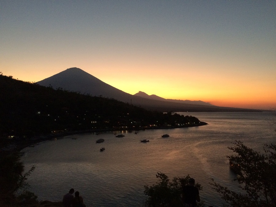 Sun setting behind Mount Agung, viewed from the top of the hill at Jemeluk, Amed (Bali, Indonesia). #bali #amed #indonesia