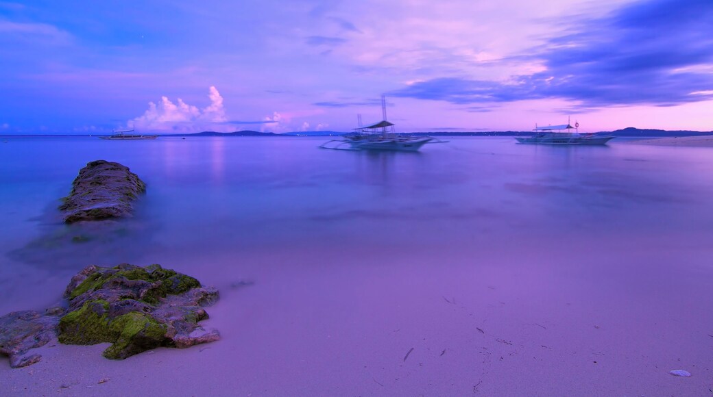 Waking up to surreal colors on the shores of Pamilacan Island in Bohol before sunrise.