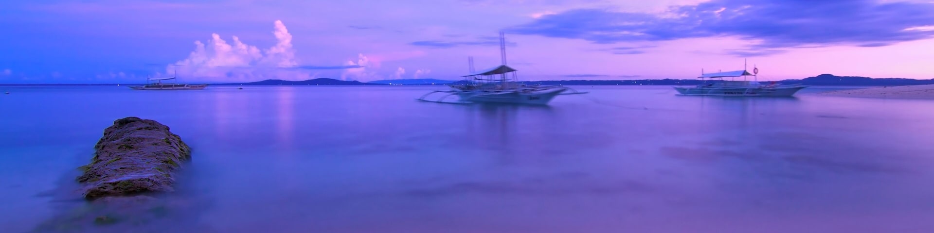 Waking up to surreal colors on the shores of Pamilacan Island in Bohol before sunrise.