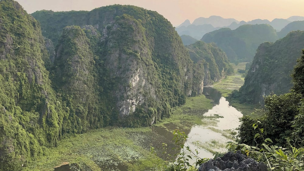 THIS IS NINH BINH! I don't see much of this place posted anywhere but it is amazing! Definitely a must visit place if you're visiting North Vietnam! It is the Halong Bay on land!