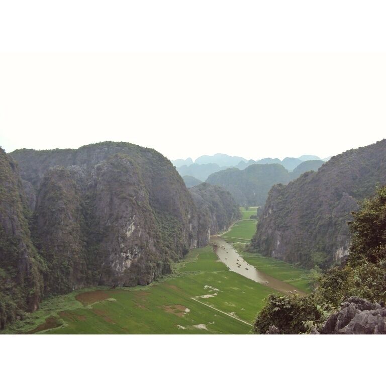 A river winding through a canyon with steep, rocky cliffs on either side.