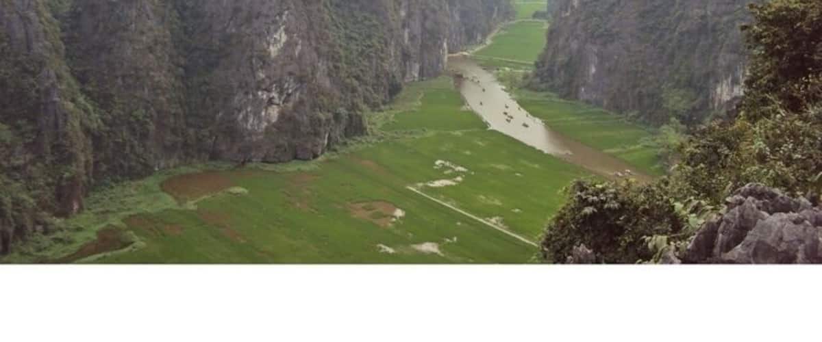 A river winding through a canyon with steep, rocky cliffs on either side.