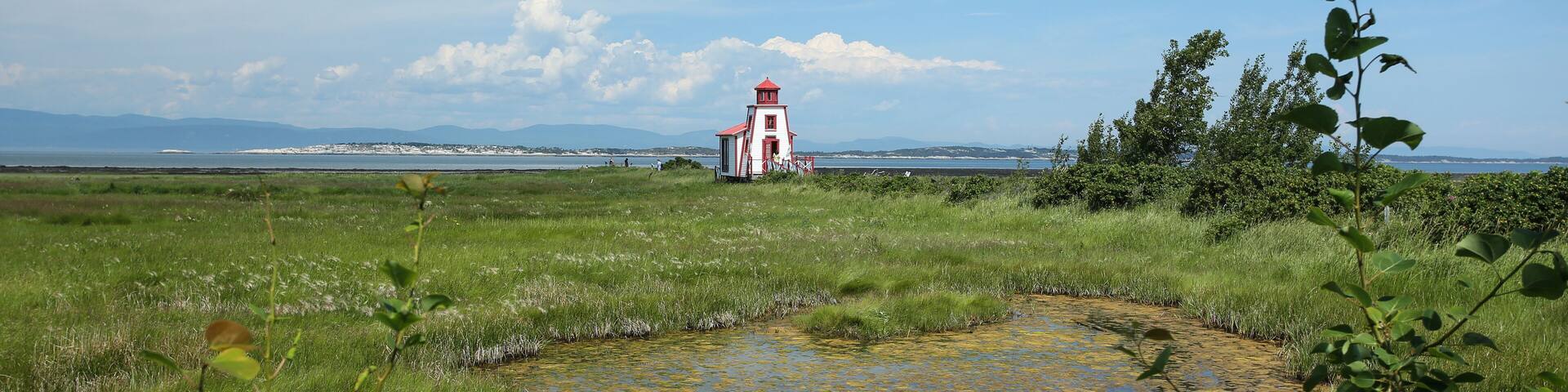 Lighthouse by the Saint Lawrence river in Saint André de Kamouraska, Quebec, Canada