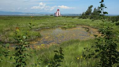 Lighthouse by the Saint Lawrence river in Saint André de Kamouraska, Quebec, Canada